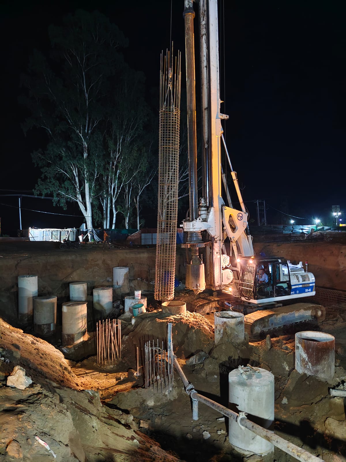 Night-time pile cap and substructure works with excavation shoring